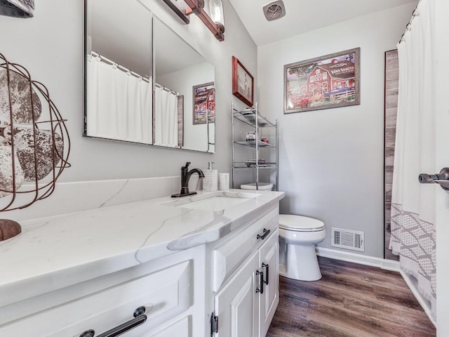464 Mason Dr, Canton, GA 30115 - bathroom featuring wood finished floors, toilet, vanity, and baseboards