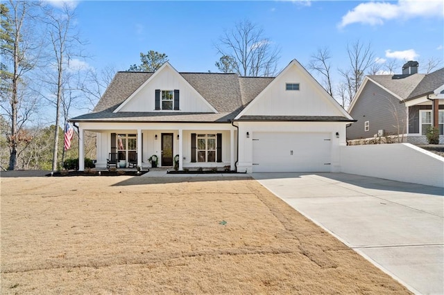 view of front of home featuring a porch and a garage