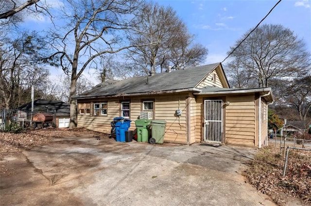 view of property exterior featuring a patio area