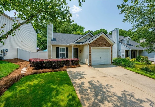 2305 Keenland Ct, Cumming, GA 30040 - view of front of house with a chimney, concrete driveway, and an attached garage