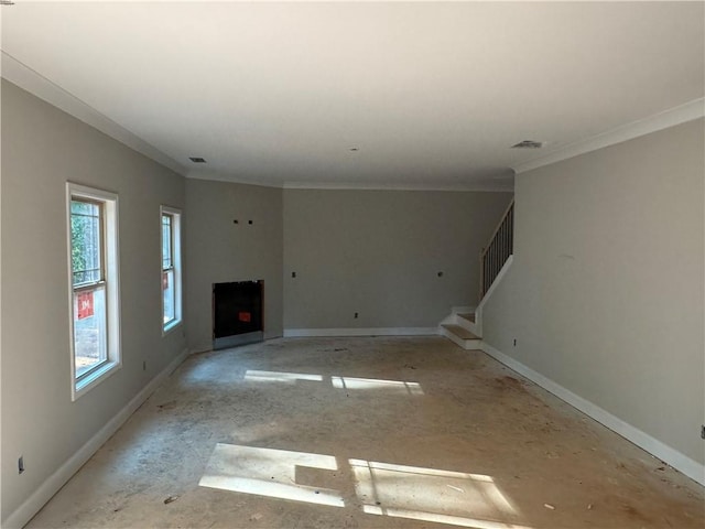 unfurnished living room featuring crown molding