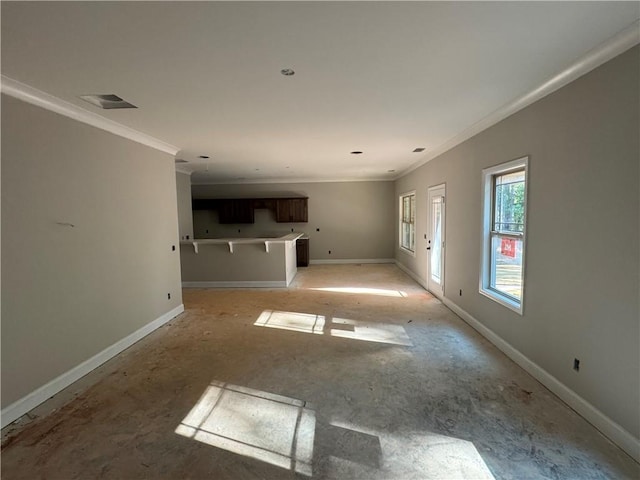 unfurnished living room with crown molding