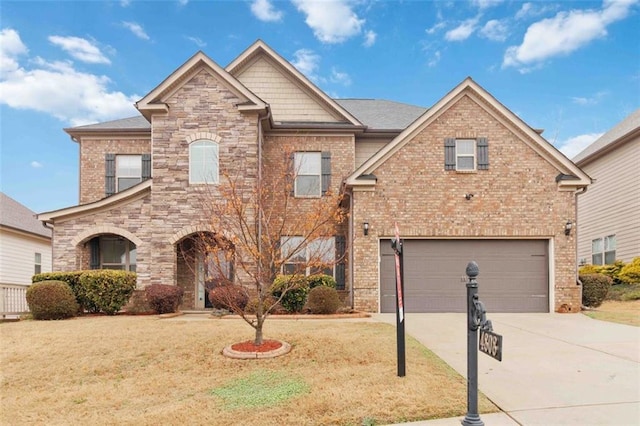 view of front of property with a garage and a front yard