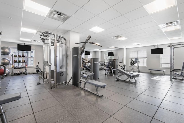 workout area featuring a paneled ceiling