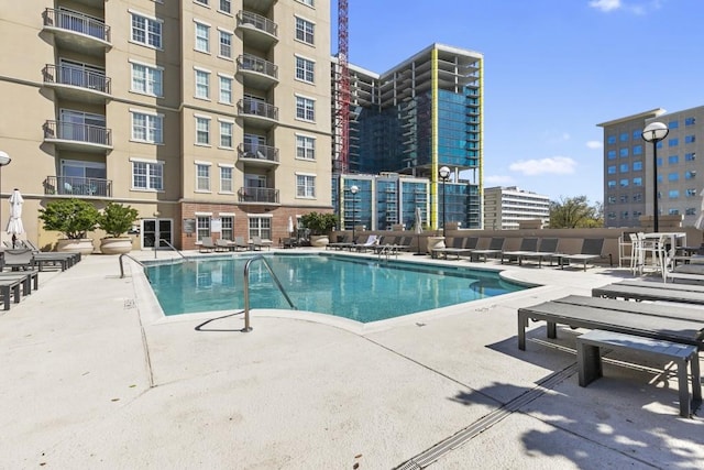 community pool with a patio