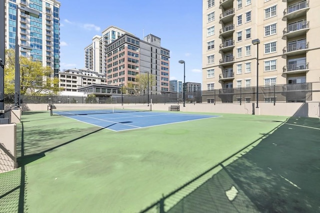 view of tennis court with fence