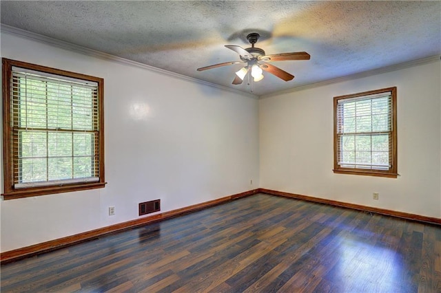 spare room featuring dark wood-style floors, visible vents, a ceiling fan, baseboards, and a textured ceiling