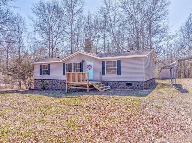 416 Nellie Ln, Trion, GA 30753 - manufactured / mobile home featuring crawl space, a deck, an outbuilding, and a storage unit
