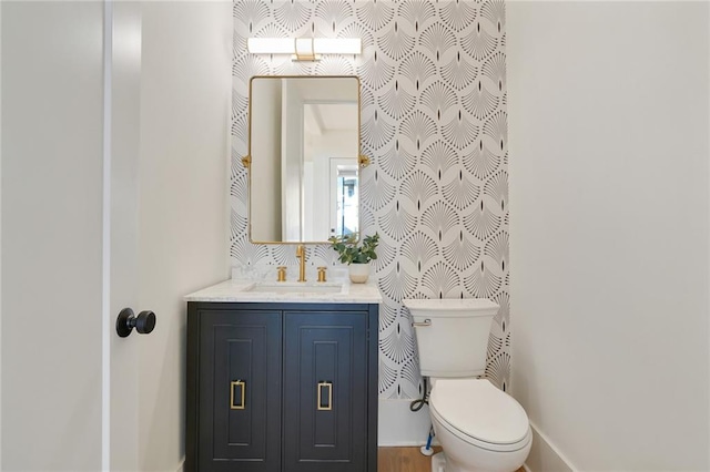 bathroom with vanity and toilet