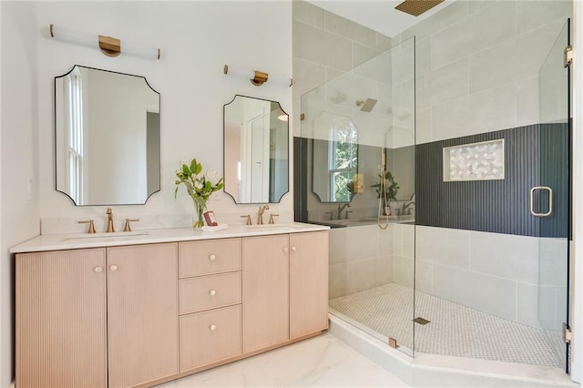 bathroom featuring vanity and an enclosed shower