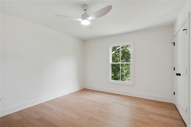 unfurnished room with ceiling fan and light wood-type flooring