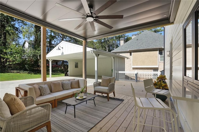 sunroom with ceiling fan and a healthy amount of sunlight