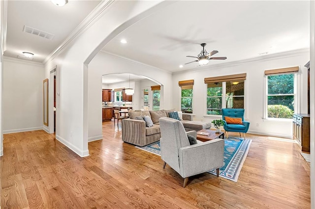 2317 Whiting Bay Cts NW, Kennesaw, GA 30152 - living room with ceiling fan, arched walkways, light wood-style floors, ornamental molding, and recessed lighting