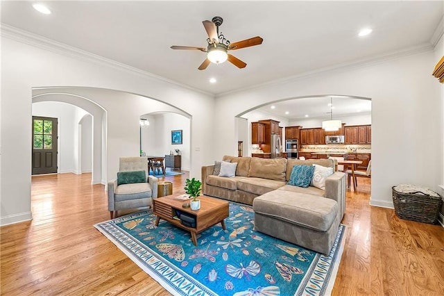 2317 Whiting Bay Cts NW, Kennesaw, GA 30152 - living room with arched walkways, a ceiling fan, light wood-type flooring, recessed lighting, and ornamental molding