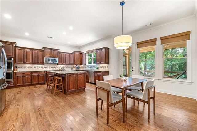 2317 Whiting Bay Cts NW, Kennesaw, GA 30152 - dining room featuring light wood-style flooring, crown molding, and recessed lighting