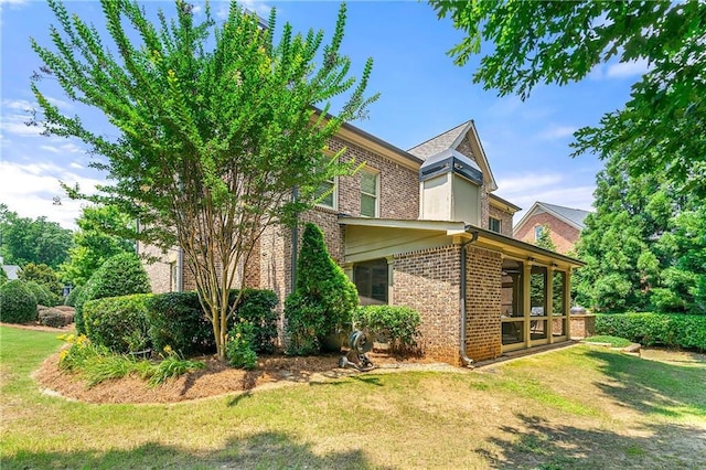 2317 Whiting Bay Cts NW, Kennesaw, GA 30152 - view of side of home with brick siding and a yard