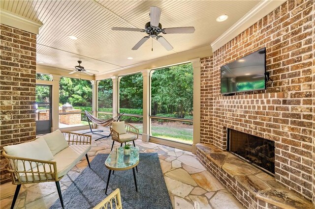 2317 Whiting Bay Cts NW, Kennesaw, GA 30152 - view of patio / terrace with ceiling fan and an outdoor living space with a fireplace