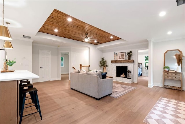455 Sams Rd, Dawsonville, GA 30534 - living area with a raised ceiling, light wood-style floors, baseboards, ceiling fan, and a fireplace