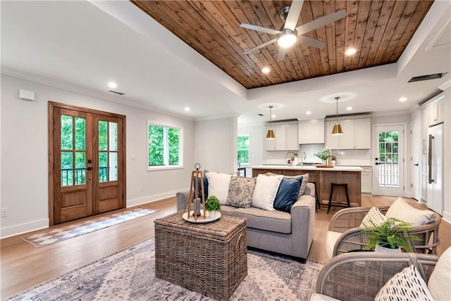 455 Sams Rd, Dawsonville, GA 30534 - living room featuring baseboards, light wood-style flooring, ceiling fan, recessed lighting, and a raised ceiling