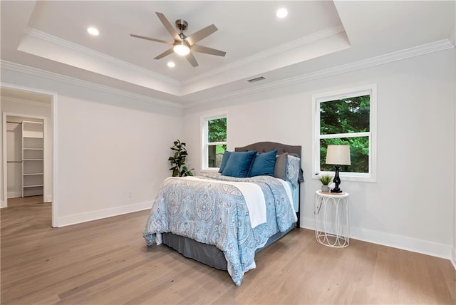 455 Sams Rd, Dawsonville, GA 30534 - bedroom with a tray ceiling, light wood finished floors, baseboards, crown molding, and ceiling fan