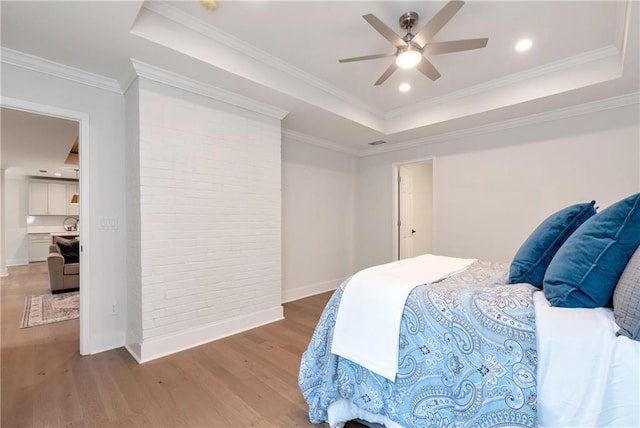 455 Sams Rd, Dawsonville, GA 30534 - bedroom featuring a raised ceiling, wood finished floors, baseboards, brick wall, and ceiling fan