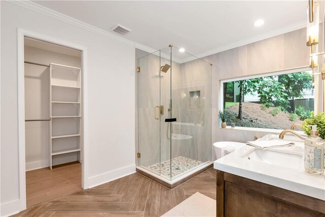 455 Sams Rd, Dawsonville, GA 30534 - bathroom with a shower stall, vanity, ornamental molding, a walk in closet, and a freestanding tub