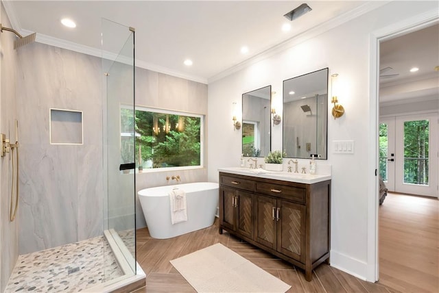 455 Sams Rd, Dawsonville, GA 30534 - full bathroom featuring a marble finish shower, double vanity, a freestanding bath, wood finished floors, and crown molding