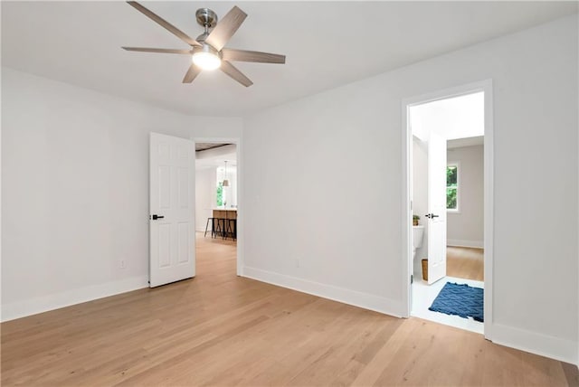 455 Sams Rd, Dawsonville, GA 30534 - empty room featuring a ceiling fan, light wood finished floors, and baseboards