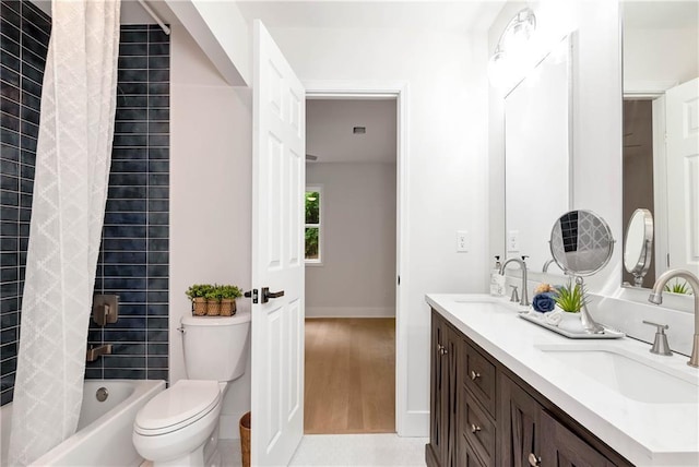 455 Sams Rd, Dawsonville, GA 30534 - bathroom with double vanity, toilet, shower / bath combo with shower curtain, baseboards, and wood finished floors