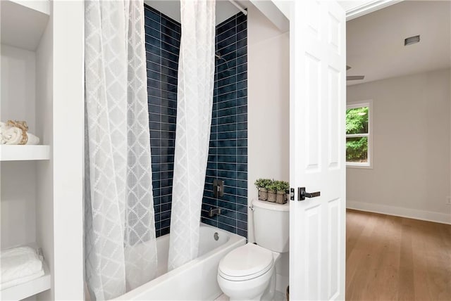 455 Sams Rd, Dawsonville, GA 30534 - full bath with wood finished floors, toilet, shower / tub combo, and baseboards