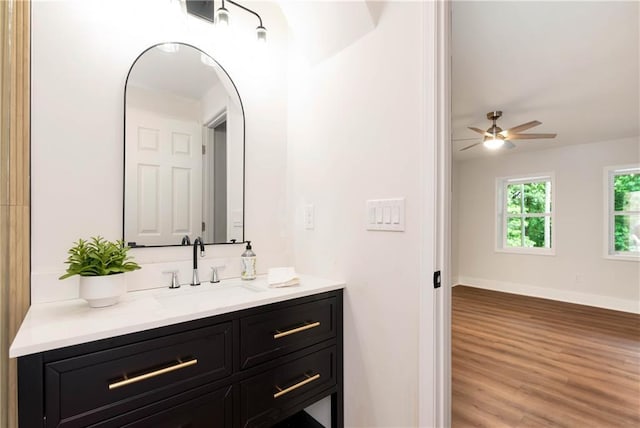 455 Sams Rd, Dawsonville, GA 30534 - bathroom featuring vanity, wood finished floors, ceiling fan, and baseboards