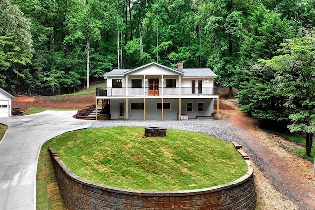 455 Sams Rd, Dawsonville, GA 30534 - view of front facade with driveway, stairs, a front yard, a fire pit, and a wooden deck