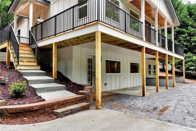 455 Sams Rd, Dawsonville, GA 30534 - doorway to property featuring board and batten siding, a patio area, and a deck