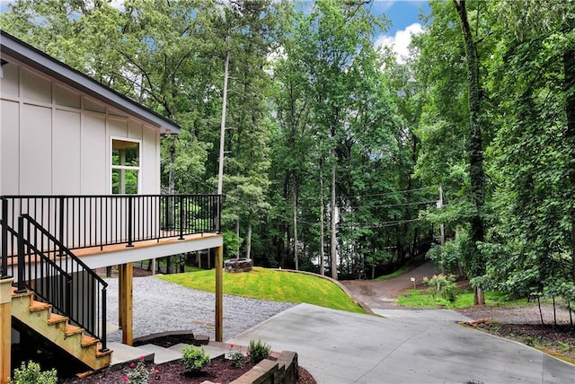455 Sams Rd, Dawsonville, GA 30534 - view of green lawn featuring a patio, a wooden deck, and stairway