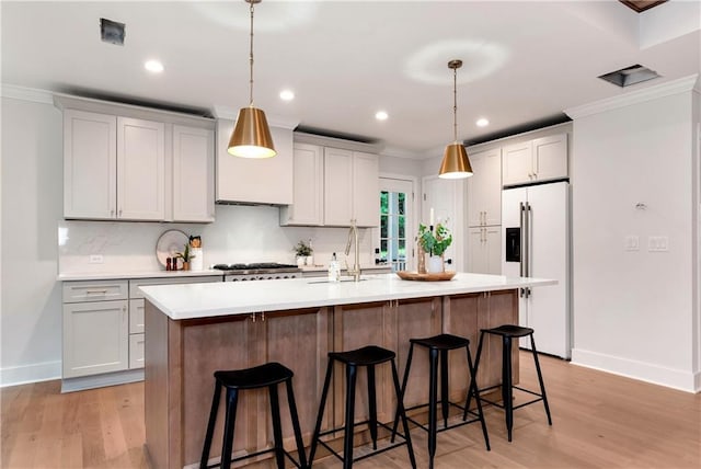 455 Sams Rd, Dawsonville, GA 30534 - kitchen with high end fridge, a sink, crown molding, baseboards, and light countertops