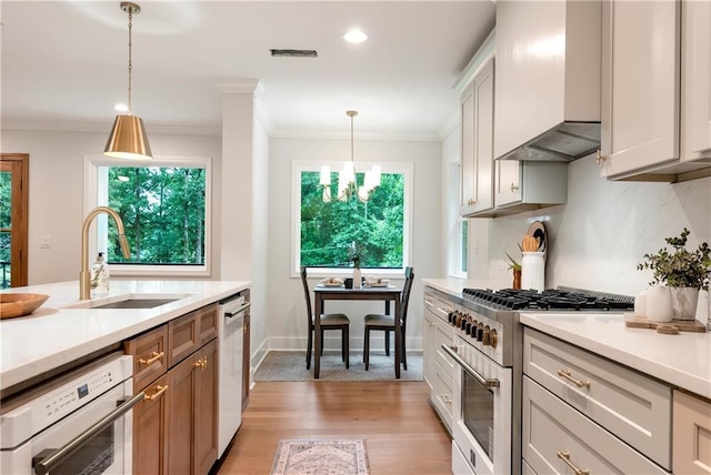 455 Sams Rd, Dawsonville, GA 30534 - kitchen with high end stainless steel range oven, wall chimney exhaust hood, a sink, dishwashing machine, and light countertops