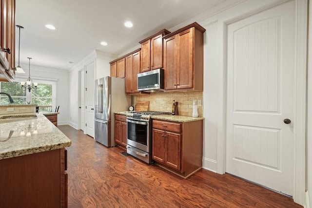 23 Durana Ct, Dallas, GA 30132 - kitchen featuring stainless steel appliances, a sink, crown molding, dark wood-style flooring, and backsplash