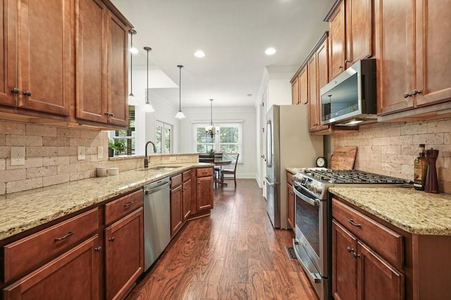 23 Durana Ct, Dallas, GA 30132 - kitchen with appliances with stainless steel finishes, a sink, dark wood-type flooring, light stone counters, and decorative backsplash