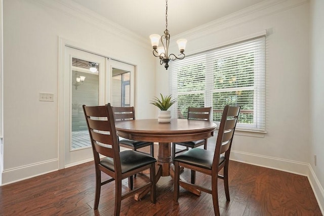 23 Durana Ct, Dallas, GA 30132 - dining area with crown molding, baseboards, healthy amount of natural light, dark wood-style floors, and a chandelier