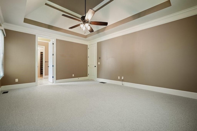 23 Durana Ct, Dallas, GA 30132 - unfurnished room featuring a tray ceiling, crown molding, ceiling fan, baseboards, and light carpet