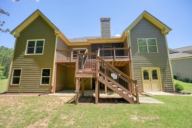 23 Durana Ct, Dallas, GA 30132 - rear view of house with stairs, a chimney, a wooden deck, and a lawn