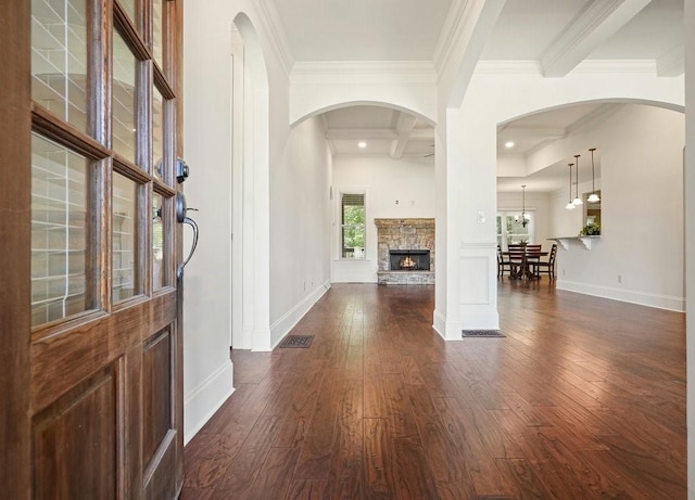 23 Durana Ct, Dallas, GA 30132 - foyer entrance with dark wood-type flooring, a fireplace, ornamental molding, baseboards, and beamed ceiling