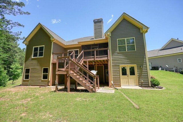 23 Durana Ct, Dallas, GA 30132 - back of house featuring stairway, a chimney, a wooden deck, and a yard