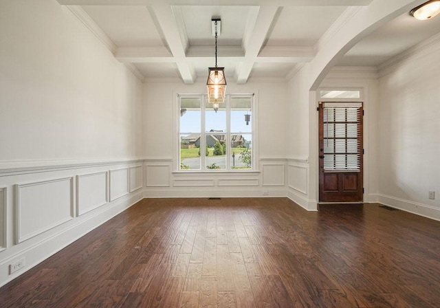 23 Durana Ct, Dallas, GA 30132 - unfurnished room featuring dark wood finished floors, beamed ceiling, arched walkways, coffered ceiling, and a wainscoted wall