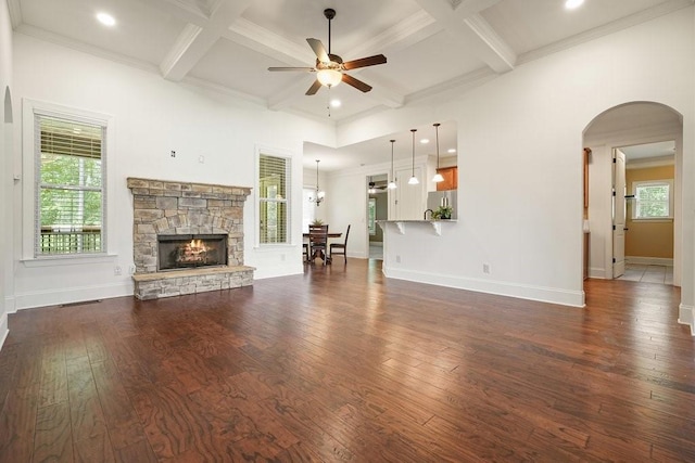 23 Durana Ct, Dallas, GA 30132 - living area featuring ceiling fan, dark wood-style flooring, arched walkways, coffered ceiling, and a fireplace