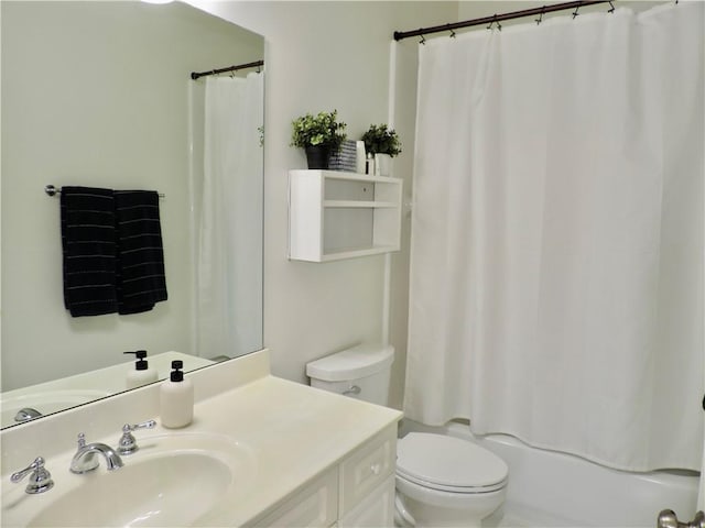 bathroom with toilet, shower / bath combo, and vanity