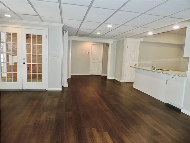 interior space with baseboards, dark wood finished floors, french doors, and recessed lighting