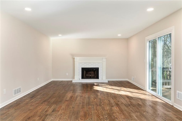 unfurnished living room with dark hardwood / wood-style flooring