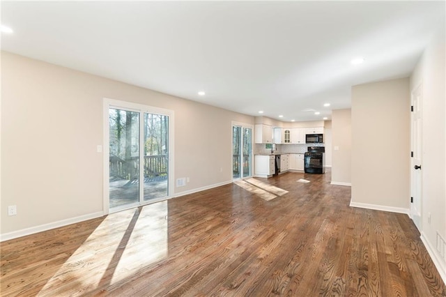 unfurnished living room featuring light hardwood / wood-style flooring