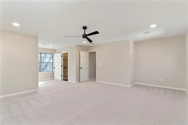 carpeted empty room with ceiling fan